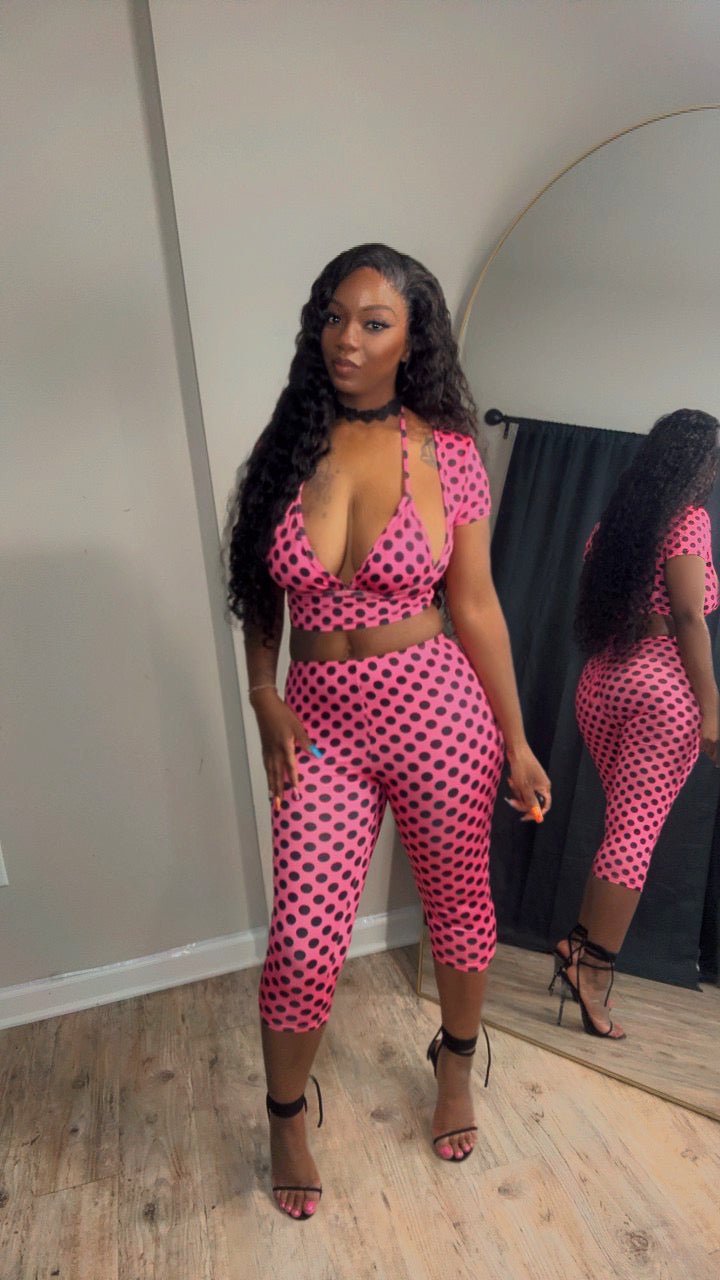 She is 5'2 modeling a pink and black polka dot three-piece set consisting of a halter crop top and matching high-waisted capri pants.